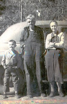 Mrs Minnie Rice (standing on right) with her husband and son