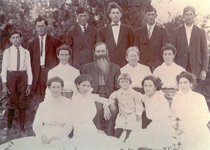 Sol and Ann Shelton family c.1920.
Back row: Hubert Shelton, Lattie Shelton, Wade Shelton, Grant Shelton (nephew), Courtland Shelton, Oscar Shelton.
Middle row: Donna Shelton, Sol (Soloman) Shelton, Ann Haire Shelton, Laduska Shelton.
Front row: Roxanna Shelton, Virginia Shelton, Paul Shelton (Donna's son), Stella Shelton, Effie Shelton.
[All of Sol and Ann's children are in this photo except Everette, who was shot and killed in 1895.]